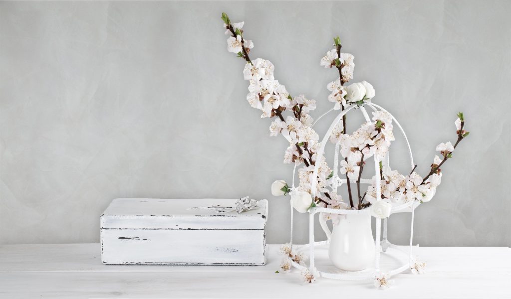 Birdcage with apricot flowers and old vintage casket with rose in Shabby Chic style